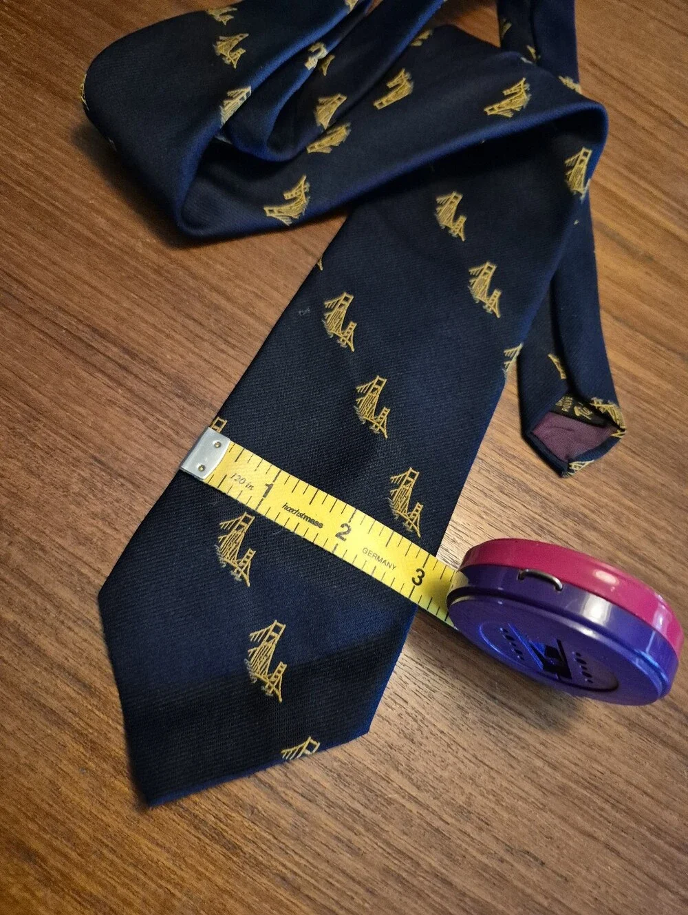 Vintage 69s Navy Tie with Gold Bridge Motif